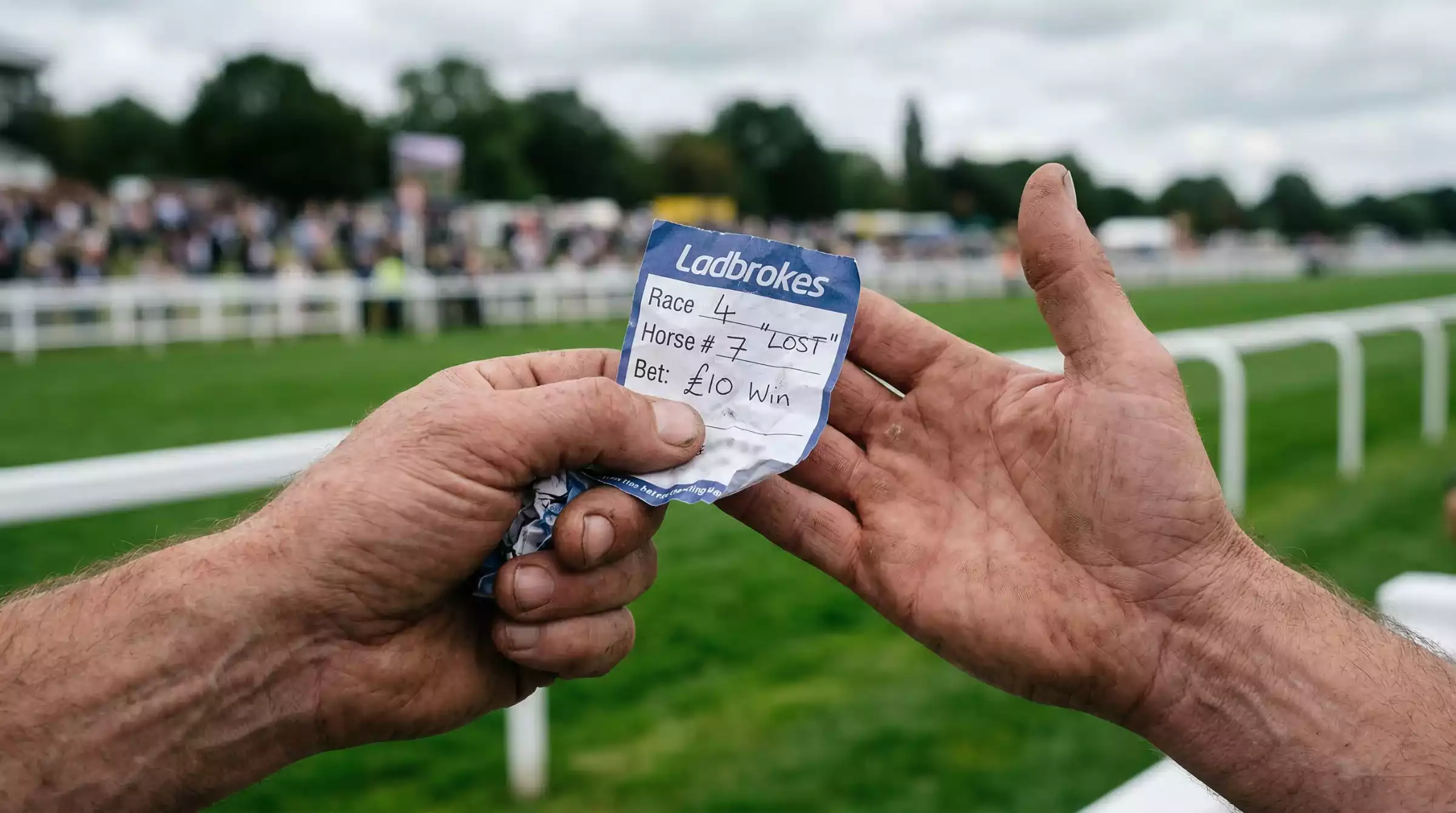 Punter looking at a voided betting slip after a non-runner